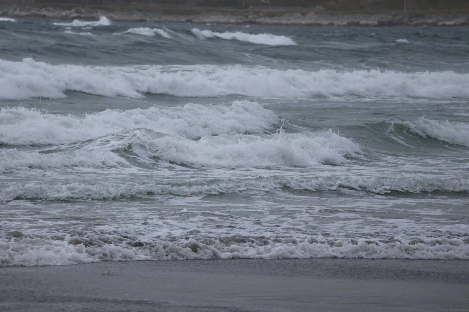 Waves rolling toward a beach
